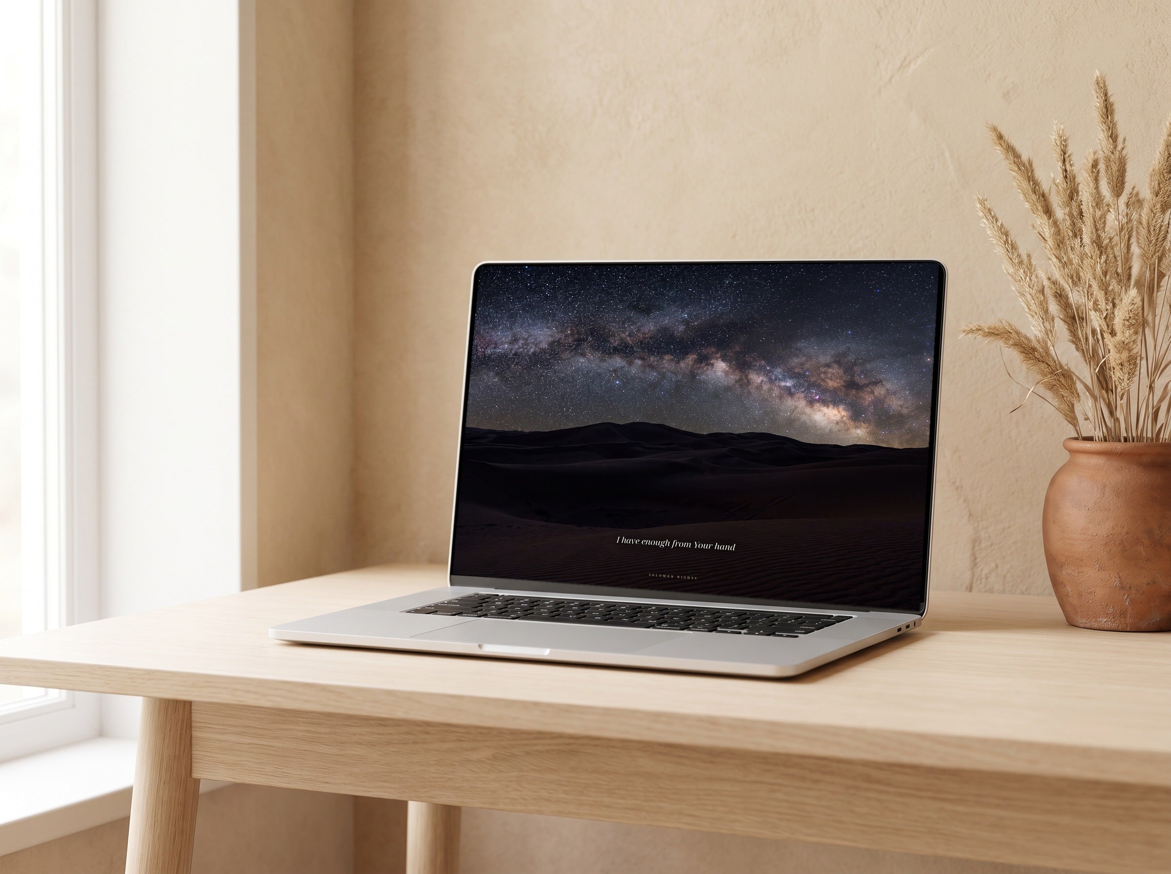 Under a Desert Sky desktop wallpaper on a laptop